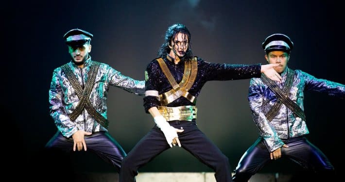 Jason Jackson Michael Jackson tribute artist performing with two dancers