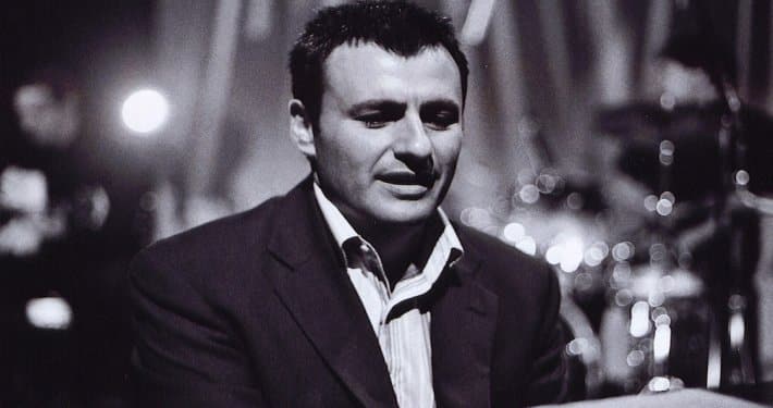 Mark Amato, musical director and keyboard player, performing live